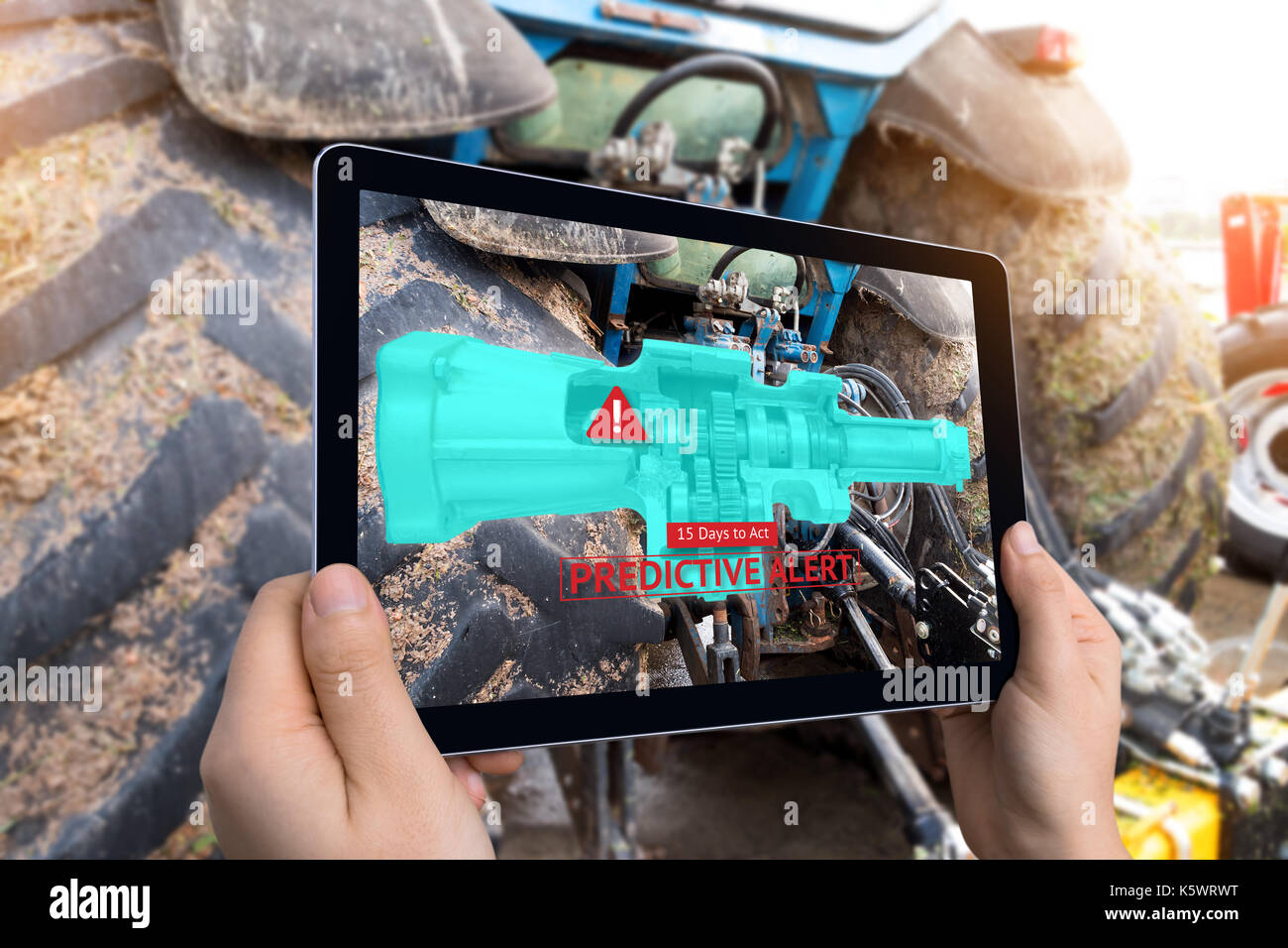 Industrial 4.0 , Augmented reality technology , smart agriculture and farm concept. Hand holding tablet with AR maintenance application and predictive Stock Photo