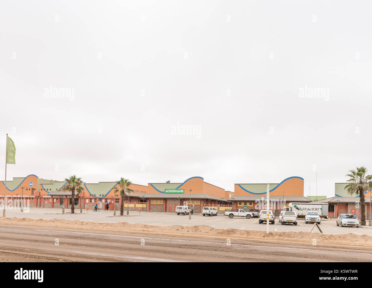 HENTIES BAY, NAMIBIA - JUNE 29, 2017: A street scene with a shopping centre in Henties Bay, a holiday town on the Skeleton Coast of Namibia Stock Photo