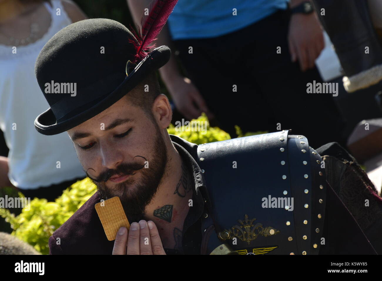 Biscuit duel at Eastbourne Steampunk Festival, Eastbourne, East Sussex, UK. This is a challenge to dip your biscuit in your drink without it breaking. Stock Photo