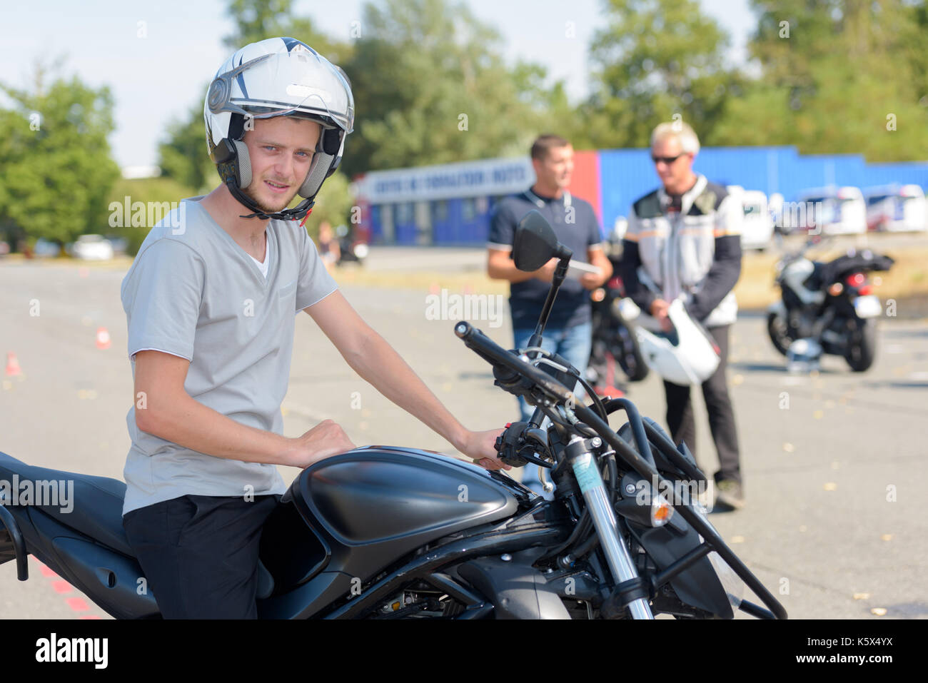 young motorcyclist gets ready to start exercise Stock Photo