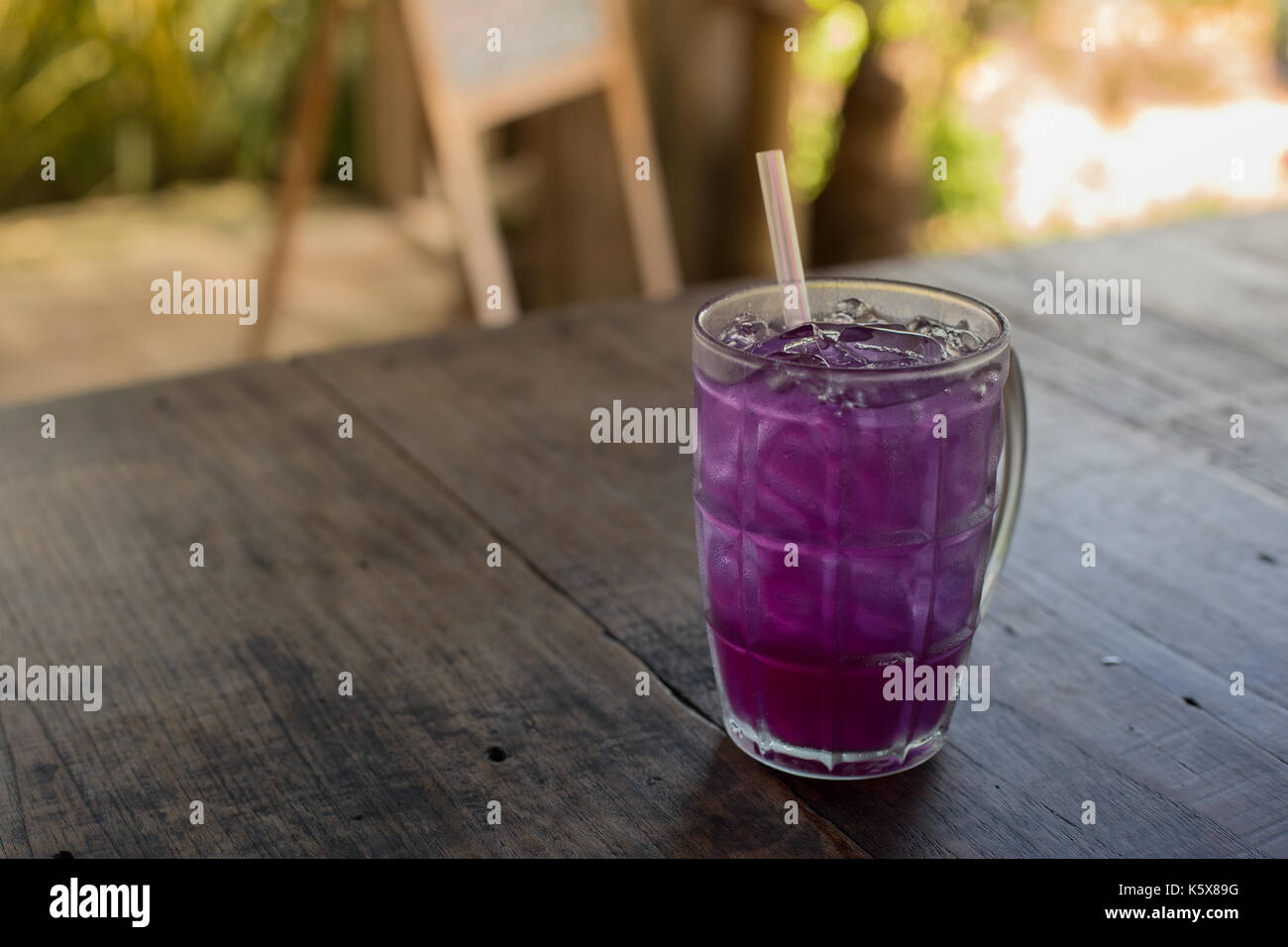Butterfly pea with lime juice on wood table Stock Photo