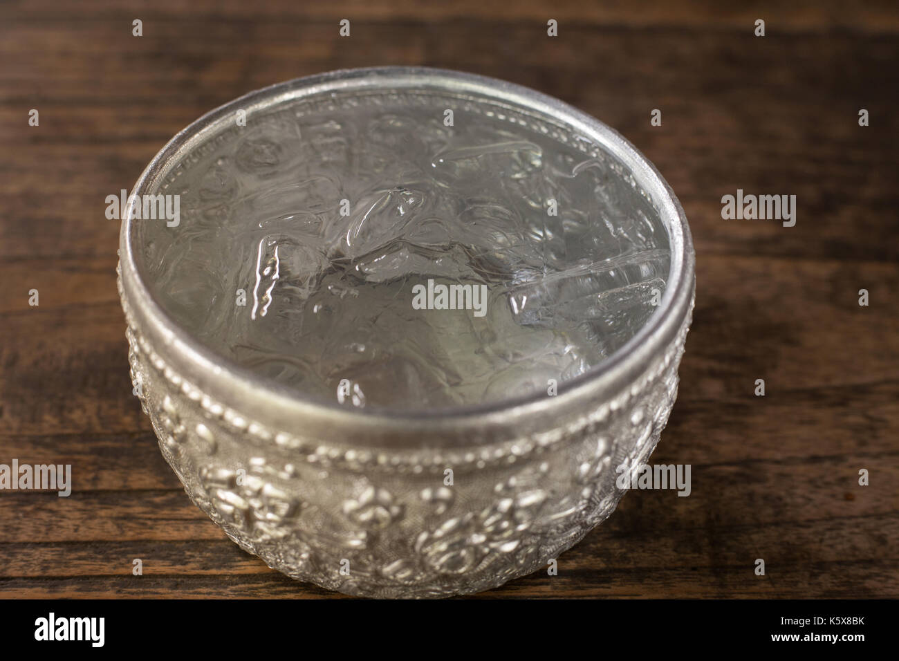 cold water in water dipper on wood background Stock Photo - Alamy