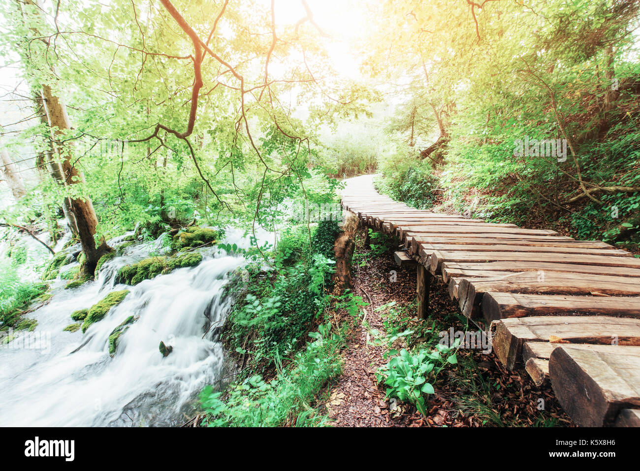 Plitvice Lakes National Park, tourist route on the wooden flooring along the waterfall Stock Photo