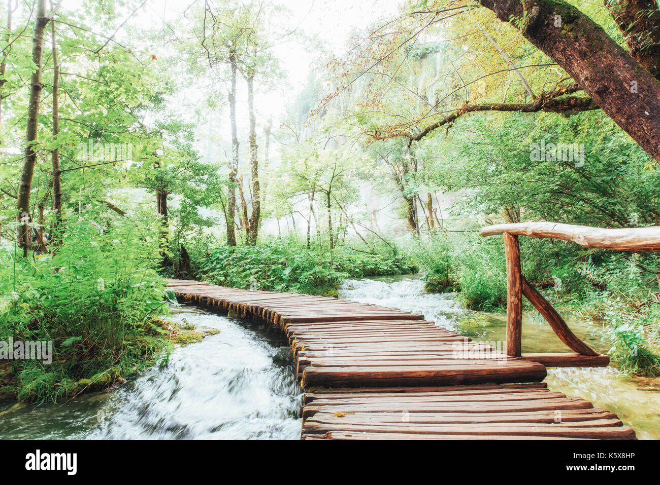 Plitvice Lakes National Park, tourist route on the wooden flooring along the waterfall Stock Photo
