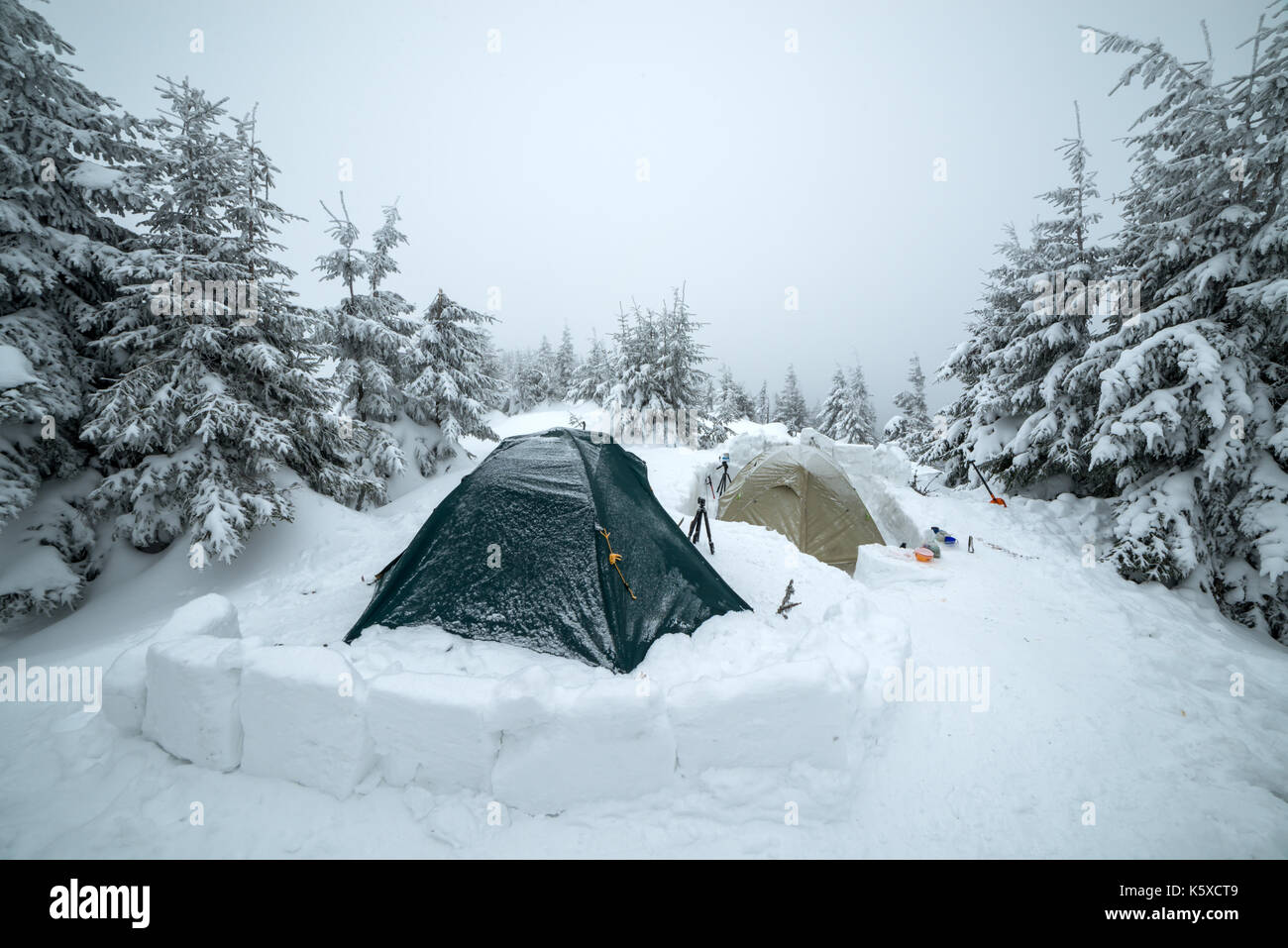 Frozen tents in the high mountain Stock Photo