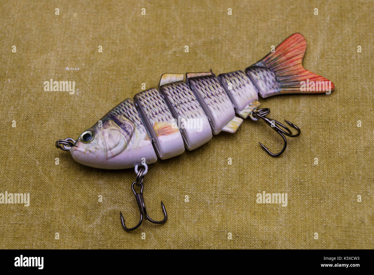 Bait for fishing on a tarpaulin background. Compound fishing wobbler Stock  Photo - Alamy