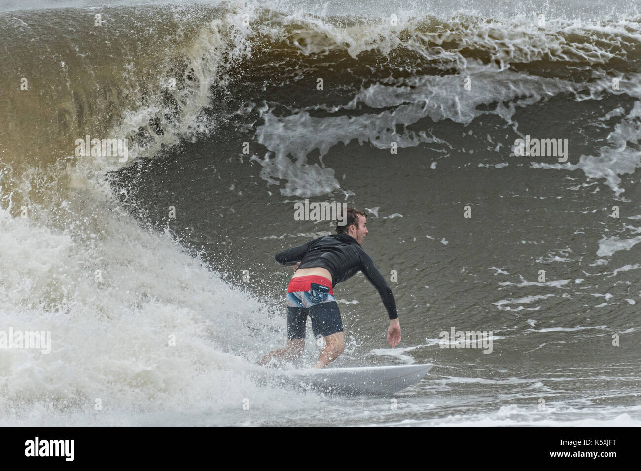 Folly Beach, United States. 10th Sep, 2017. Surfers take advantage of the extreme waves caused by tidal serge from Hurricane Irma at the Folly Washout September 10, 2017 in Folly Beach, South Carolina. Imra is expected to spare the Charleston area but hurricane will bring a tidal serge and will cause flooding along the coast. Credit: Planetpix/Alamy Live News Stock Photo