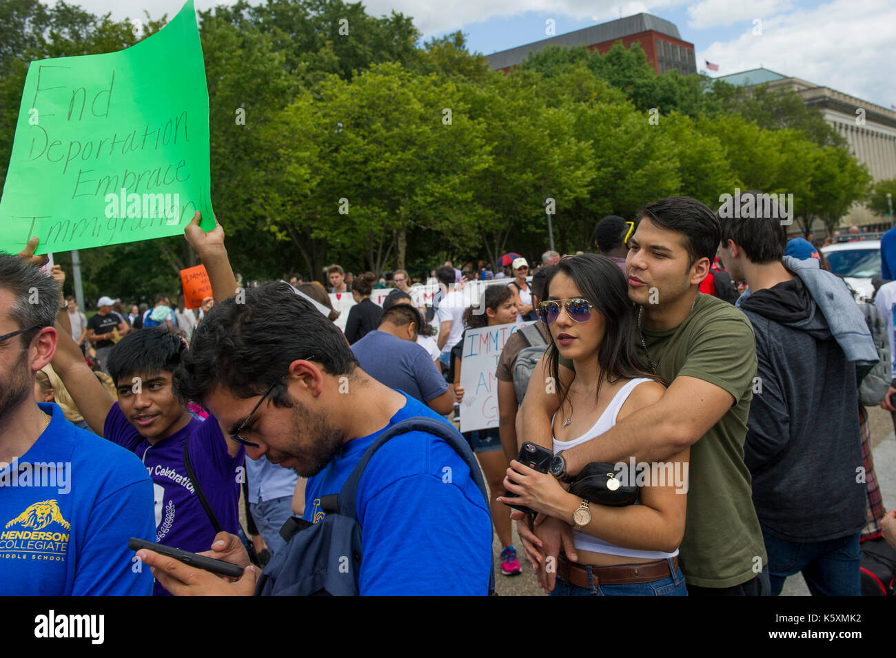 A small crowd gathers in front of the White House to protest President Donald Trump's intention to rescind the Deferred Action for Childhood Arrivals Act, also known as DACA or the Dream Act. Deferred Action for Childhood Arrivals (DACA) is a kind of administrative relief from deportation. The purpose of DACA is to protect eligible immigrant youth who came to the United States when they were children from deportation. DACA gives young undocumented immigrants: 1) protection from deportation, and 2) a work permit. The program expires after two years, subject to renewal. Stock Photo