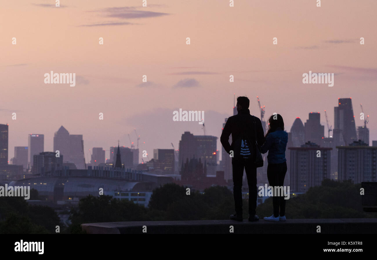London, UK. 11th Sep, 2017. London, September 11 2017. A couple admire the view of the London skyline as a new day breaks over the city. Credit: Paul Davey/Alamy Live News Stock Photo