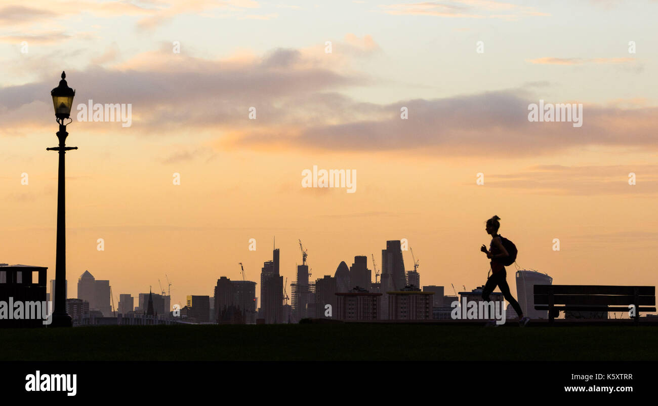 London, UK. 11th Sep, 2017. London, September 11 2017. A runner on Primrose hill makes a silhouette against the London skyline as a new day breaks over the city. Credit: Paul Davey/Alamy Live News Stock Photo