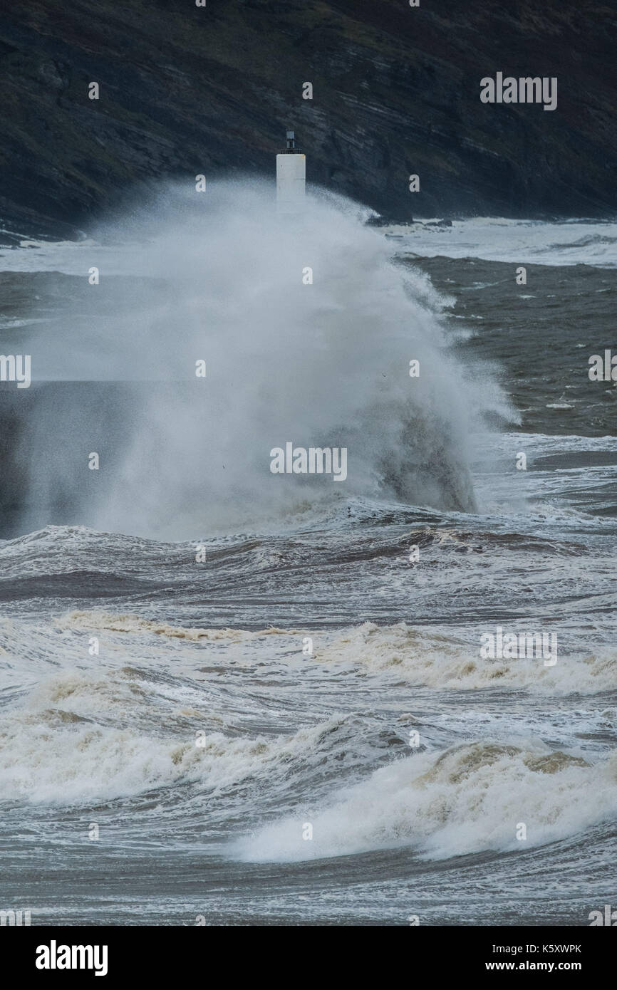 Aberystwyth Wales UK, Monday 11 September 2017 UK Weather: Strong gale force winds and stormy seas batter the harbour lighthouse and seashore in Aberystwyth on the coast of Cardigan Bay in west Wales. A Met Office ‘yellow' warning has been issued for south western regions of the UK, with gusts of up to 60mph expected during the morning. photo Credit: Keith Morris/Alamy Live News Stock Photo