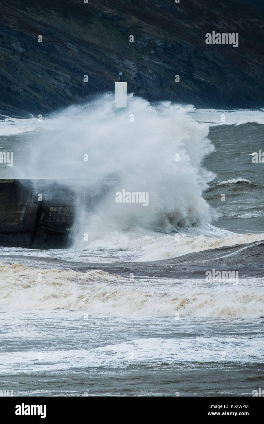 Aberystwyth Wales UK, Monday 11 September 2017 UK Weather: Strong gale force winds and stormy seas batter the harbour lighthouse and seashore in Aberystwyth on the coast of Cardigan Bay in west Wales. A Met Office ‘yellow' warning has been issued for south western regions of the UK, with gusts of up to 60mph expected during the morning. photo Credit: Keith Morris/Alamy Live News Stock Photo