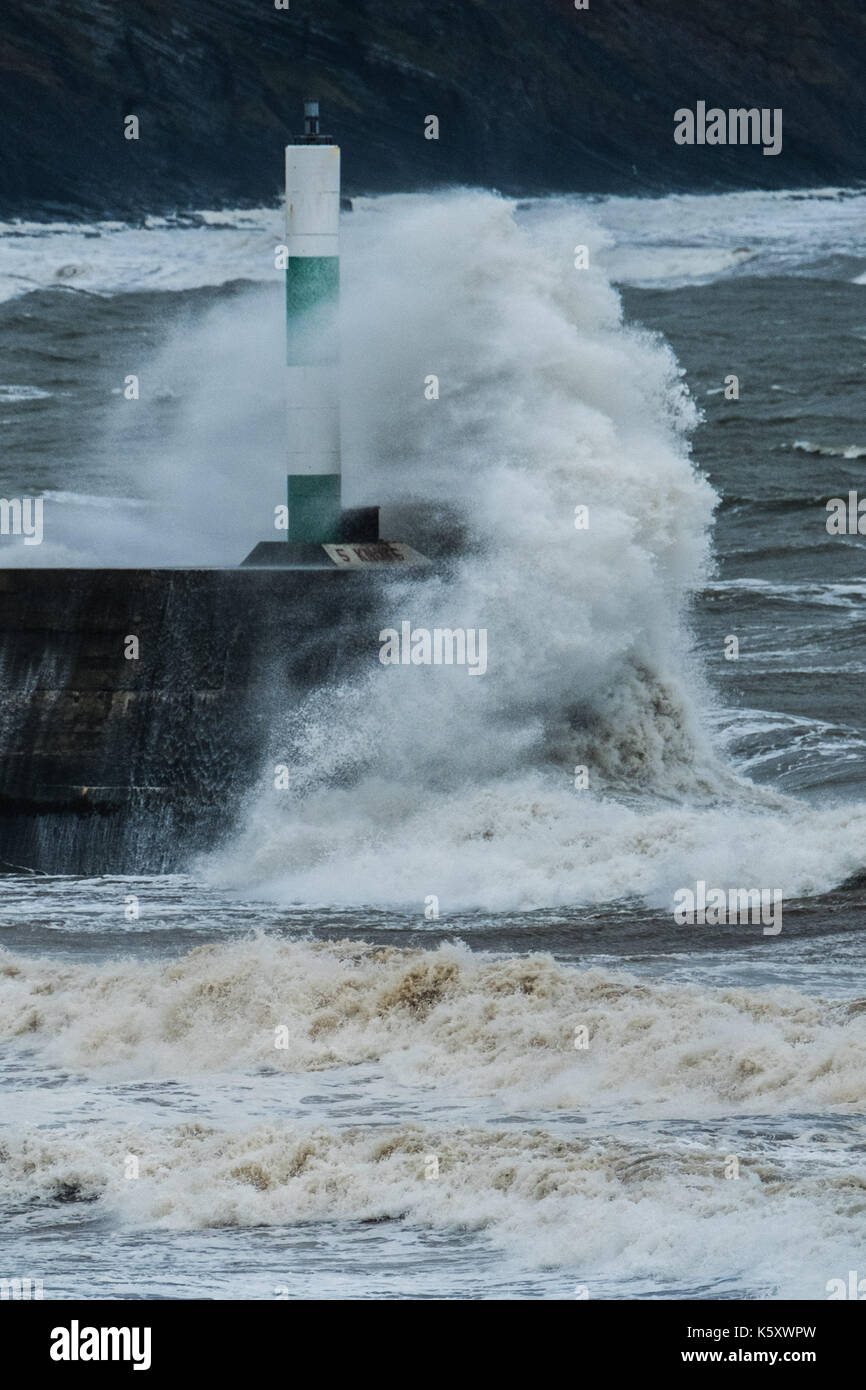 Aberystwyth Wales UK, Monday 11 September 2017 UK Weather: Strong gale force winds and stormy seas batter the harbour lighthouse and seashore in Aberystwyth on the coast of Cardigan Bay in west Wales. A Met Office ‘yellow' warning has been issued for south western regions of the UK, with gusts of up to 60mph expected during the morning. photo Credit: Keith Morris/Alamy Live News Stock Photo
