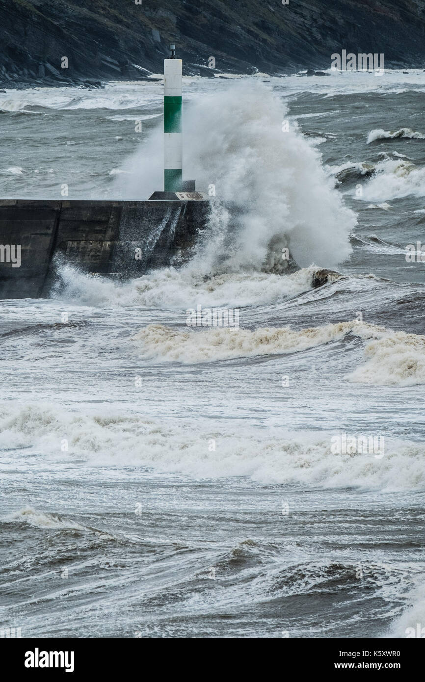 Aberystwyth Wales UK, Monday 11 September 2017 UK Weather: Strong gale force winds and stormy seas batter the harbour lighthouse and seashore in Aberystwyth on the coast of Cardigan Bay in west Wales. A Met Office ‘yellow' warning has been issued for south western regions of the UK, with gusts of up to 60mph expected during the morning. photo Credit: Keith Morris/Alamy Live News Stock Photo