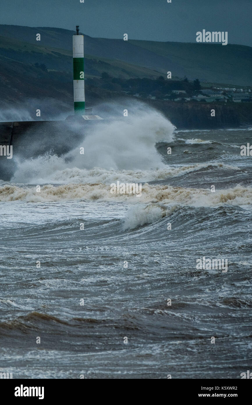 Aberystwyth Wales UK, Monday 11 September 2017 UK Weather: Strong gale force winds and stormy seas batter the harbour lighthouse and seashore in Aberystwyth on the coast of Cardigan Bay in west Wales. A Met Office ‘yellow' warning has been issued for south western regions of the UK, with gusts of up to 60mph expected during the morning. photo Credit: Keith Morris/Alamy Live News Stock Photo