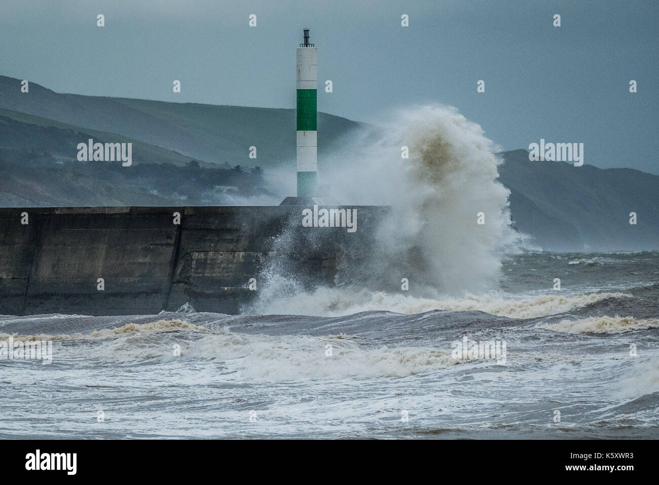 Aberystwyth Wales UK, Monday 11 September 2017 UK Weather: Strong gale force winds and stormy seas batter the harbour lighthouse and seashore in Aberystwyth on the coast of Cardigan Bay in west Wales. A Met Office ‘yellow' warning has been issued for south western regions of the UK, with gusts of up to 60mph expected during the morning. photo Credit: Keith Morris/Alamy Live News Stock Photo