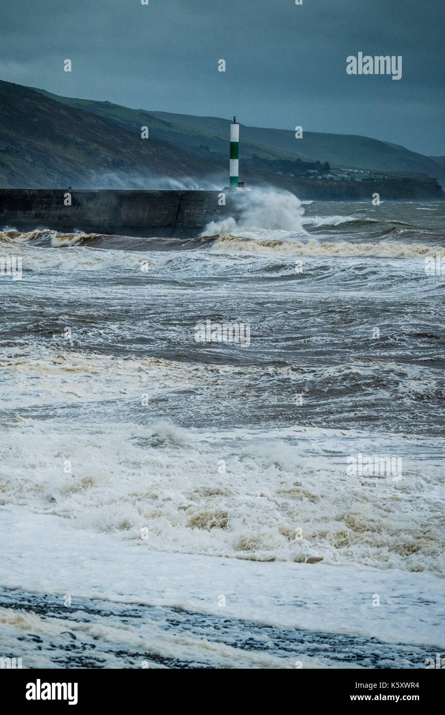 Aberystwyth Wales UK, Monday 11 September 2017 UK Weather: Strong gale force winds and stormy seas batter the harbour lighthouse and seashore in Aberystwyth on the coast of Cardigan Bay in west Wales. A Met Office ‘yellow' warning has been issued for south western regions of the UK, with gusts of up to 60mph expected during the morning. photo Credit: Keith Morris/Alamy Live News Stock Photo