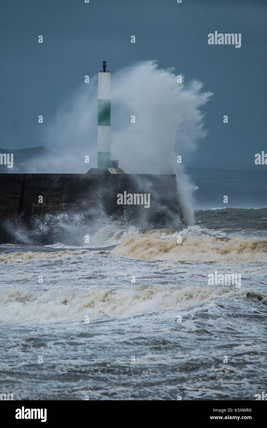 Aberystwyth Wales UK, Monday 11 September 2017 UK Weather: Strong gale force winds and stormy seas batter the harbour lighthouse and seashore in Aberystwyth on the coast of Cardigan Bay in west Wales. A Met Office ‘yellow' warning has been issued for south western regions of the UK, with gusts of up to 60mph expected during the morning. photo Credit: Keith Morris/Alamy Live News Stock Photo