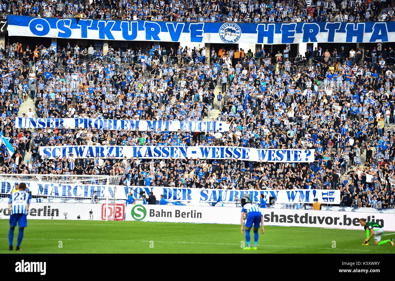 Berlin, Germany. 10th Sep, 2017. Fans of Hertha hold up banners reading: 'Unser Problem mit Euch: Schwarze Kassen, Weiße Weste. Das Märchen von der sauberen WM' (lit. 'Our problem with you: Black checkout, white vests. The fairytale of the clean World Cup') during the German Bundesliga soccer match between Hertha BSC and Werder Bremen at the Olympia stadium in Berlin, Germany, 10 September 2017. Photo: Soeren Stache/dpa/Alamy Live News Stock Photo