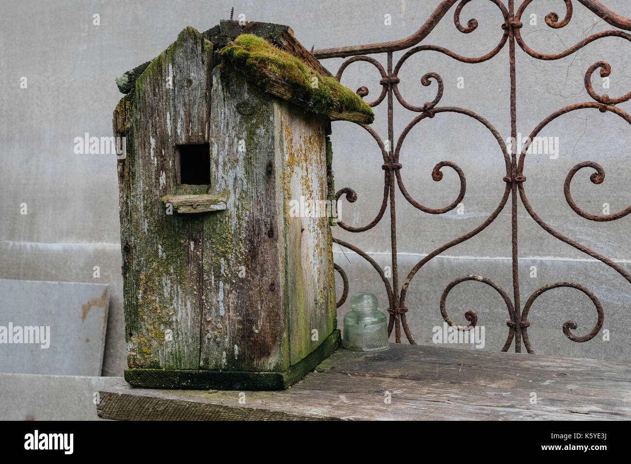 Old moss covered birdhouse. Stock Photo