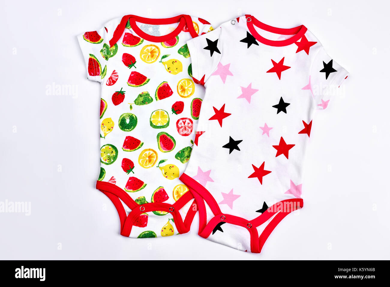 Set of beautiful babies bodysuits. Newborn baby new cotton printed bodysuits,  white background. High quality babies rompers on sale Stock Photo - Alamy