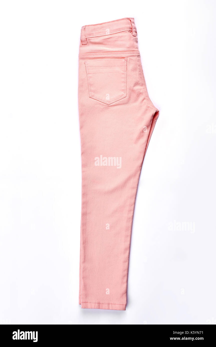 Female peach color new trousers. Young girl cotton colored jeans isolated  on white background. Youth summer fashionable garment on sale Stock Photo -  Alamy
