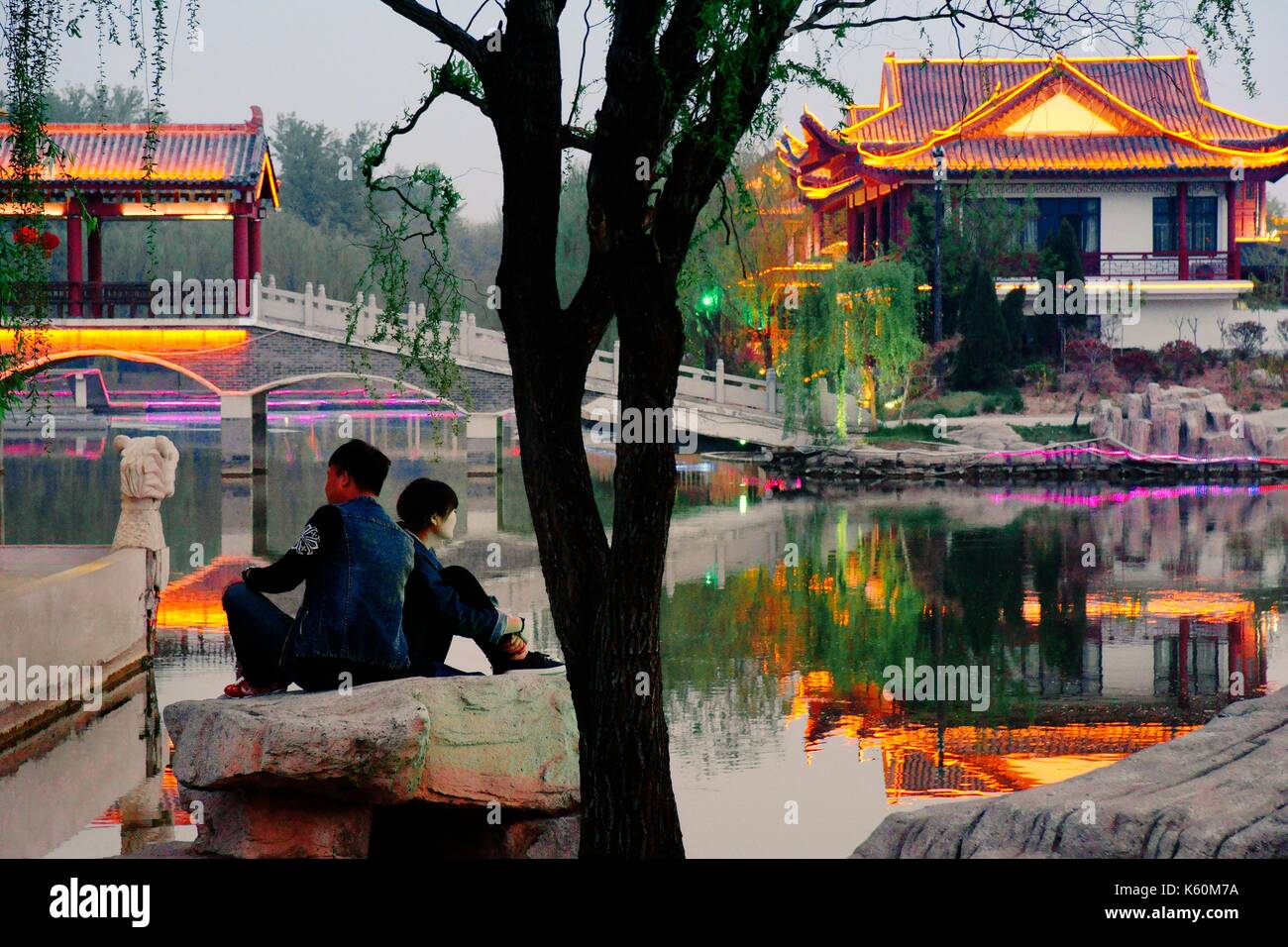 Dongzi Culture Park, a celebration of Confucian philosopher Dong Zhongshu. City of Dezhou, China. Lake pavillions. Evening light Stock Photo