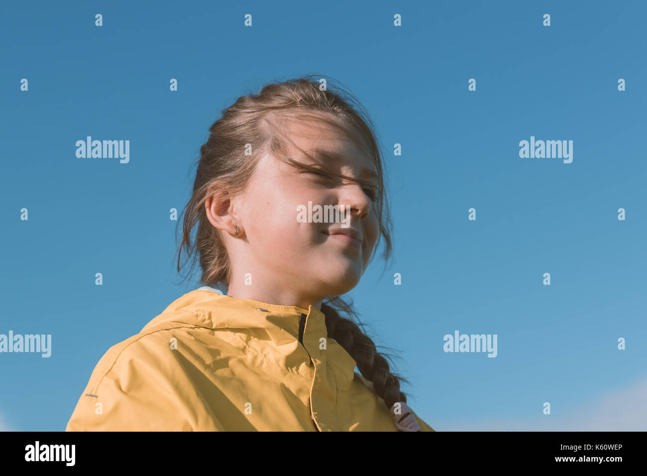 Teen girl against the sky. Stock Photo