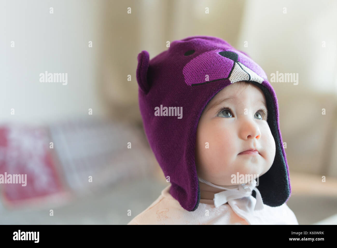 Little child in a beaver cap close up portrait. Stock Photo