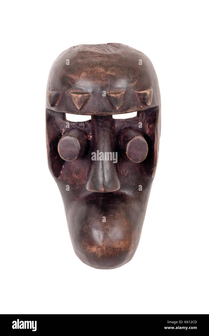 Grebo mask from Mali, carved in wood; small splits, scrapes and cracks attest to its age/use. Stock Photo