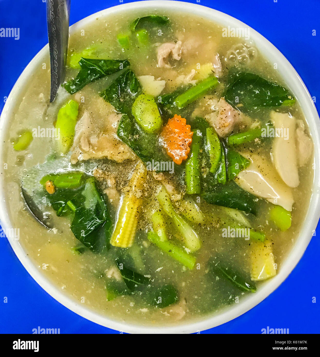 Fried flat wide noodle with pork and kale in creamy gravy sauce (Thai