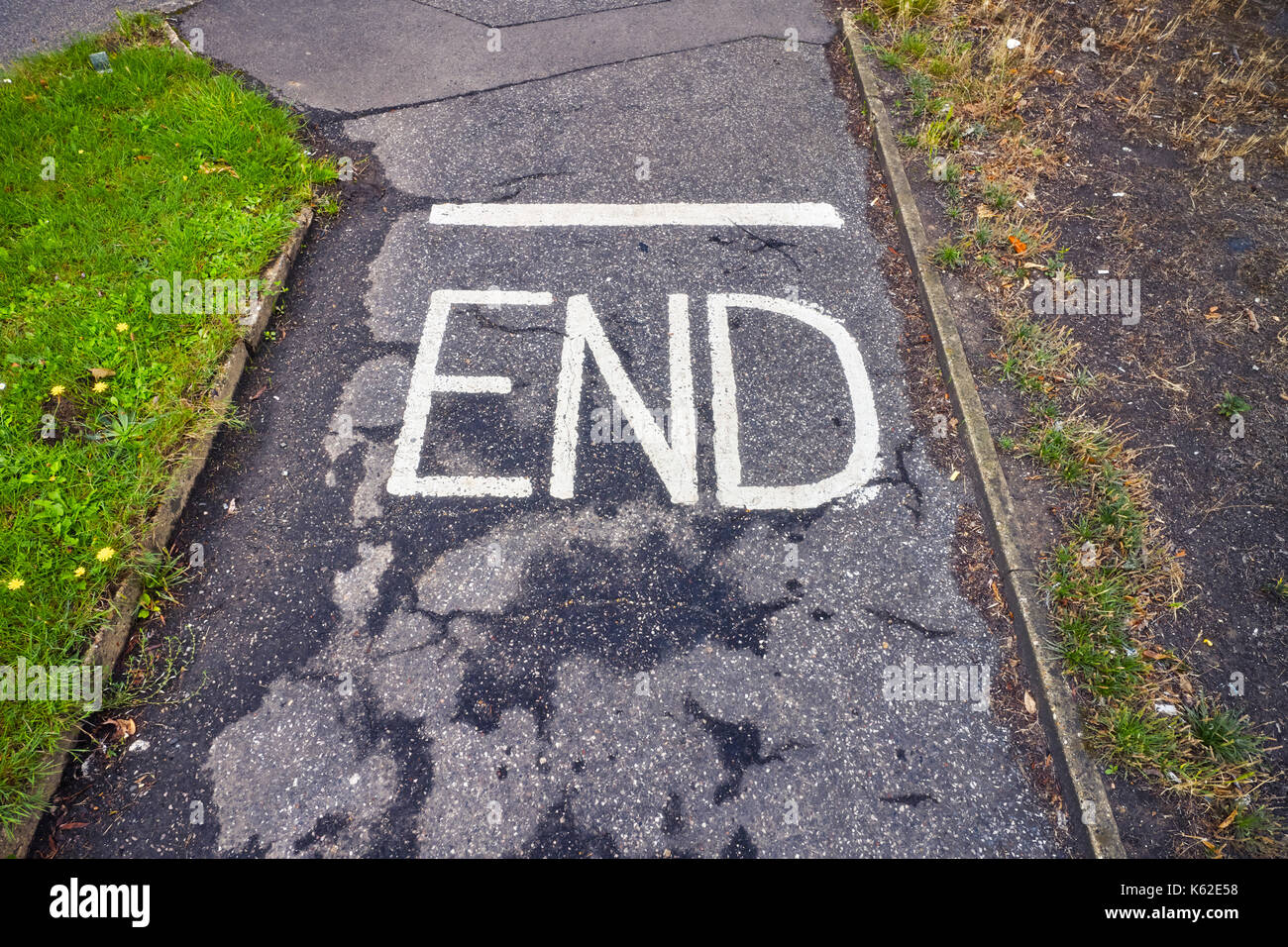 End written in white on a path Stock Photo