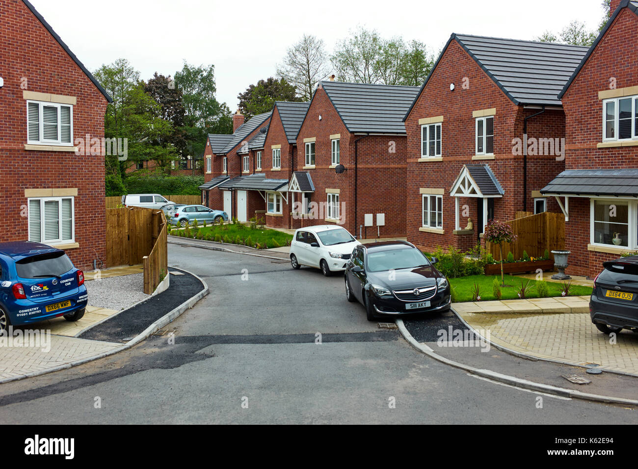 New housing estate with cars parked Stock Photo