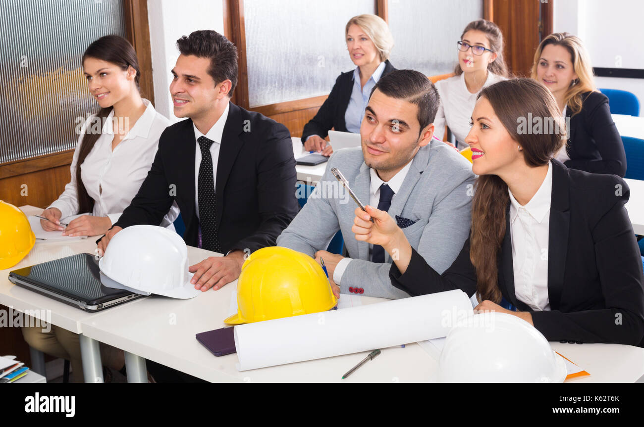 Multinational professional students and coach at design training session for employees Stock Photo