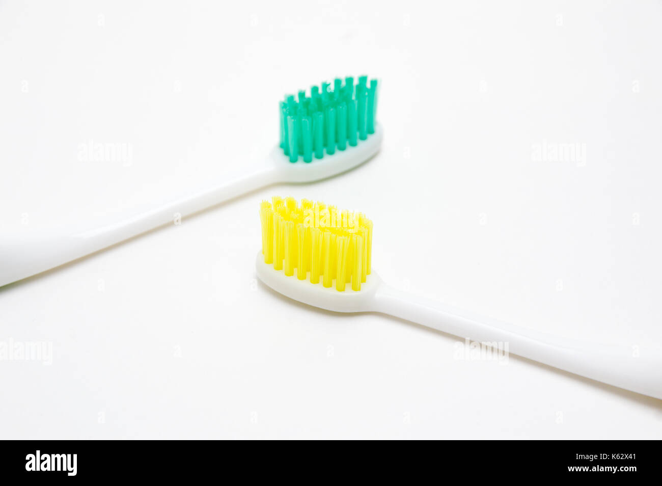 Toothbrushes on white background Stock Photo - Alamy