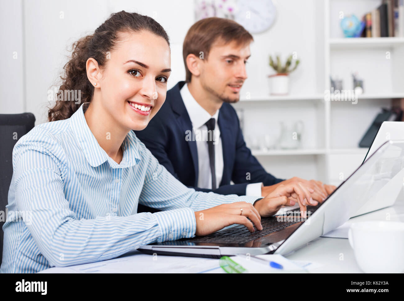 Glad Friendly Efficient Business Female Assistant Wearing Formalwear Using Laptop In Company 4476