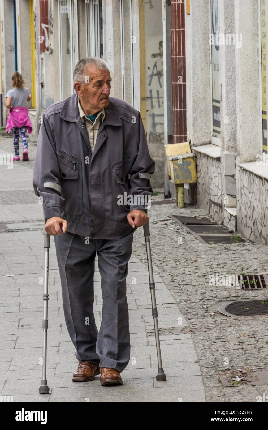 Handicapped senior walks crutches hires stock photography and images Alamy