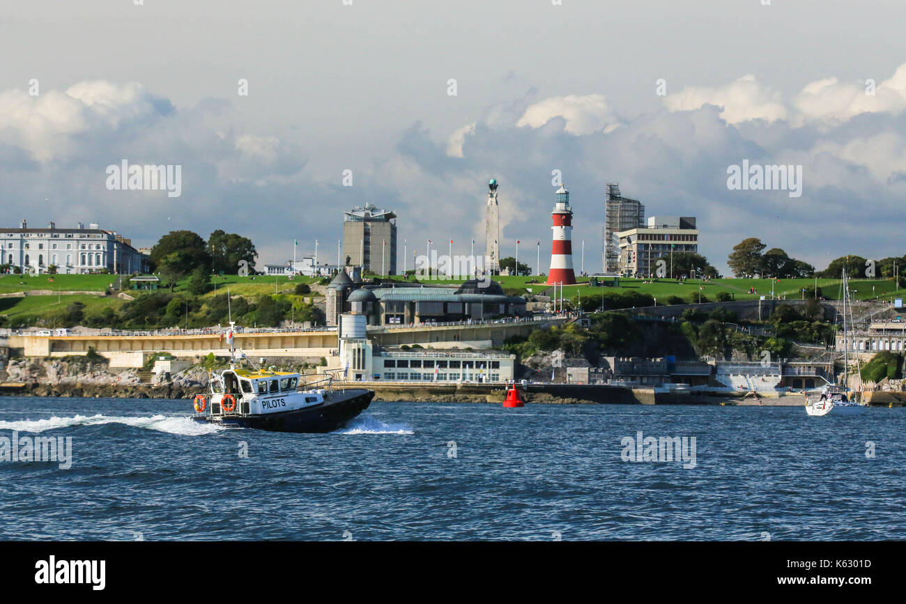 Pilot Boat sailing Into Port passing Lighthouse in Plymouth Sound. Safety Boat Stock Photo