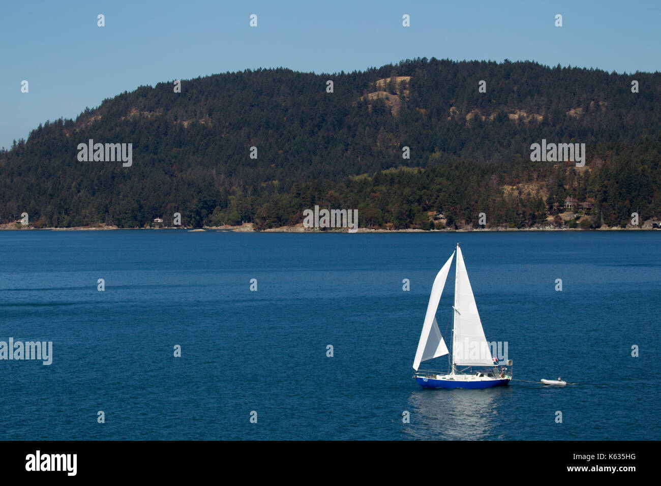 Sailing boat in the Salish Sea between the Gulf Islands at Vancouver Island, British Columbia, Canada. Stock Photo