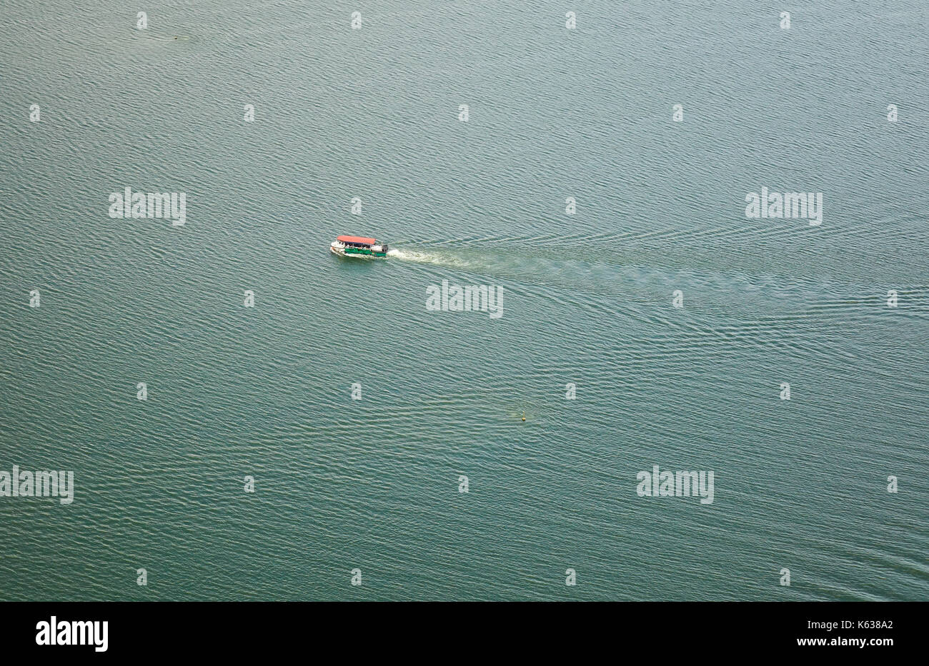 A motorboat running on blue sea. Aerial view of Singapore sea Stock ...