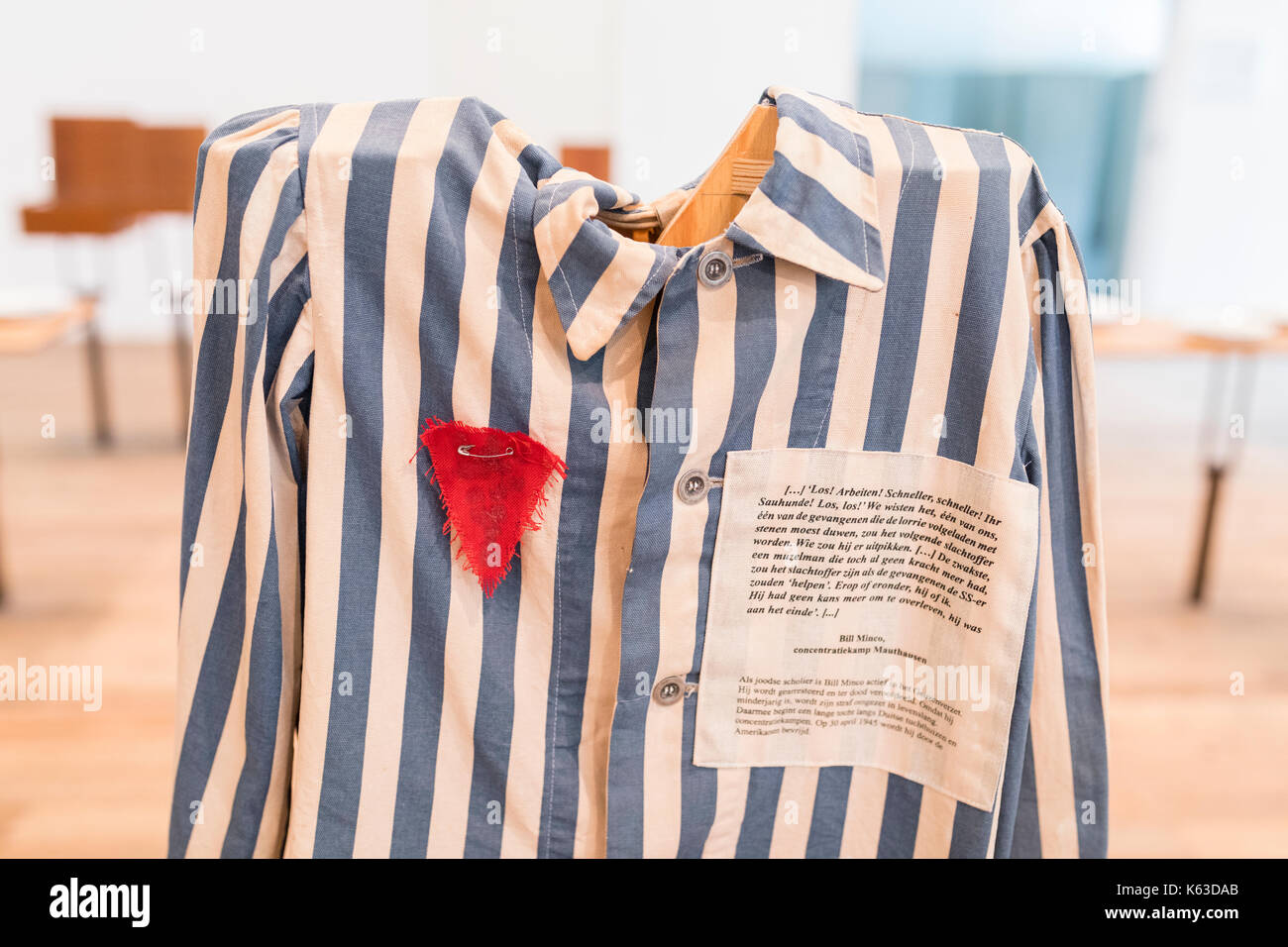 Uniform with red triangle belonging to political prisoner at former concentration camp 'kamp Vught' in the Netherlands Stock Photo