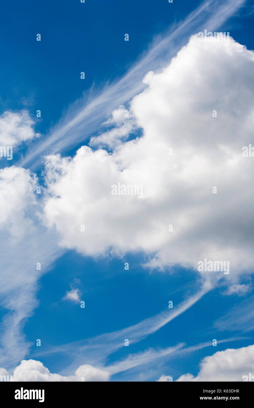 Blue sky with beautiful clouds and plane stripes Stock Photo