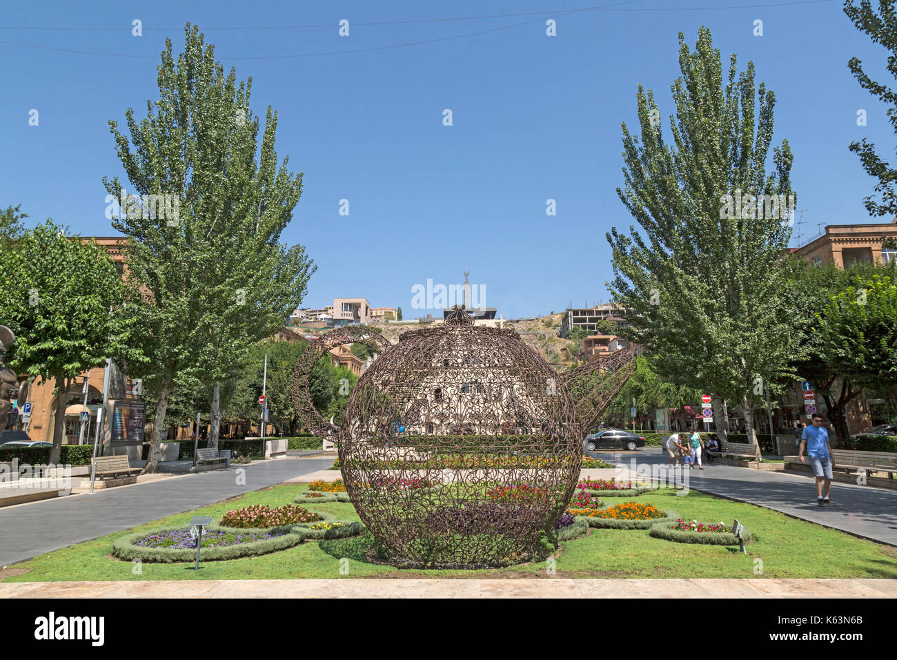 Statue  of a giant Teapot located in a flower bed as part of the Cascade Museum of Art in Yerevan, Armenia. Stock Photo