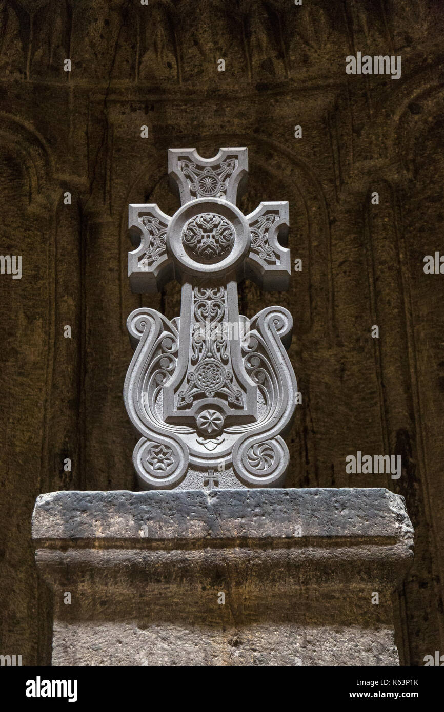 Elaborate decorative ancient stone cross in the Geghard Monastery in Armenia. Stock Photo
