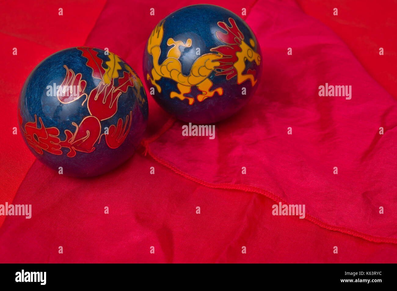 Traditional Chinese balls on a red silk background Stock Photo