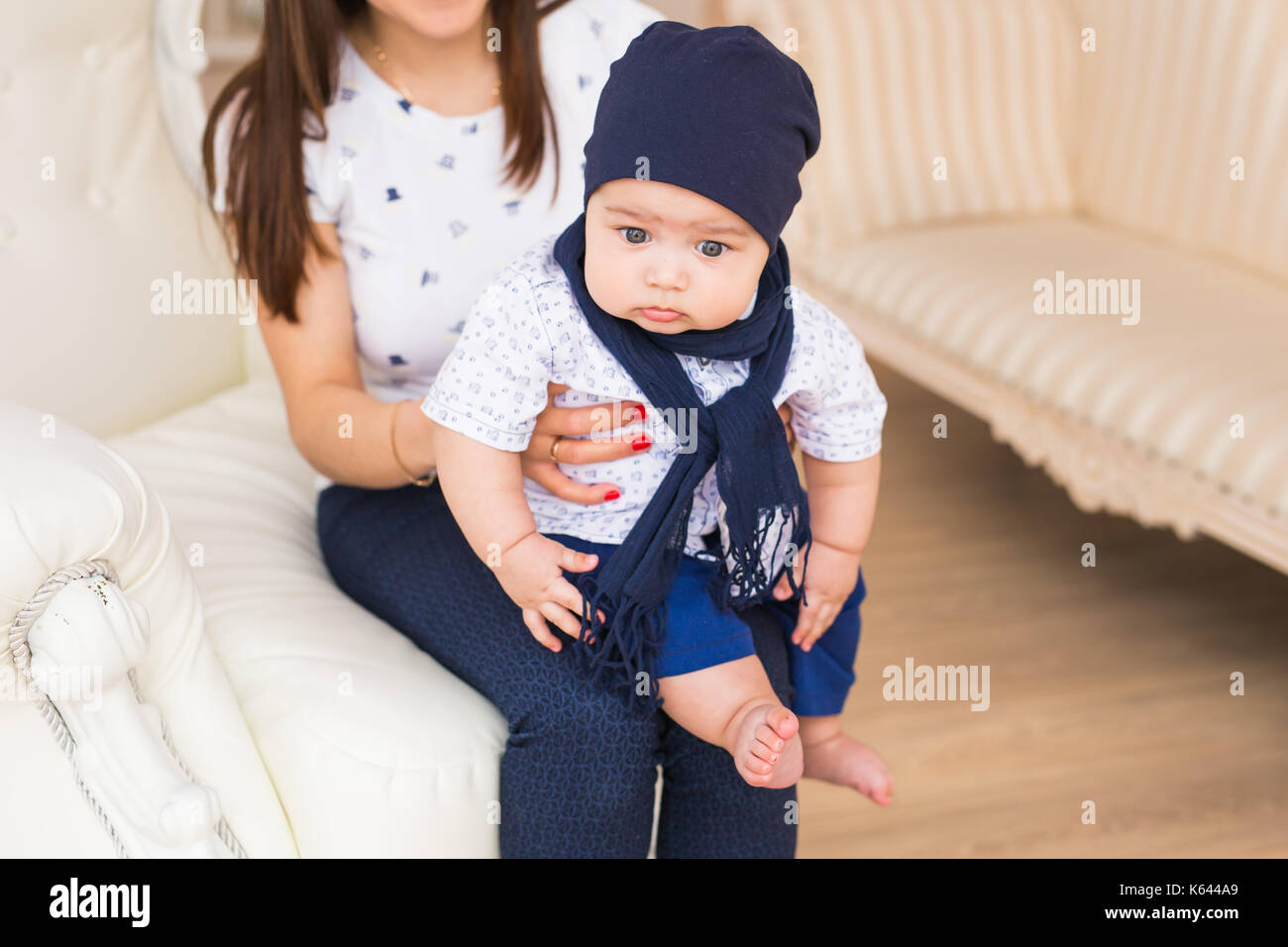 Portrait of cute baby boy wearing blue hat Stock Photo - Alamy