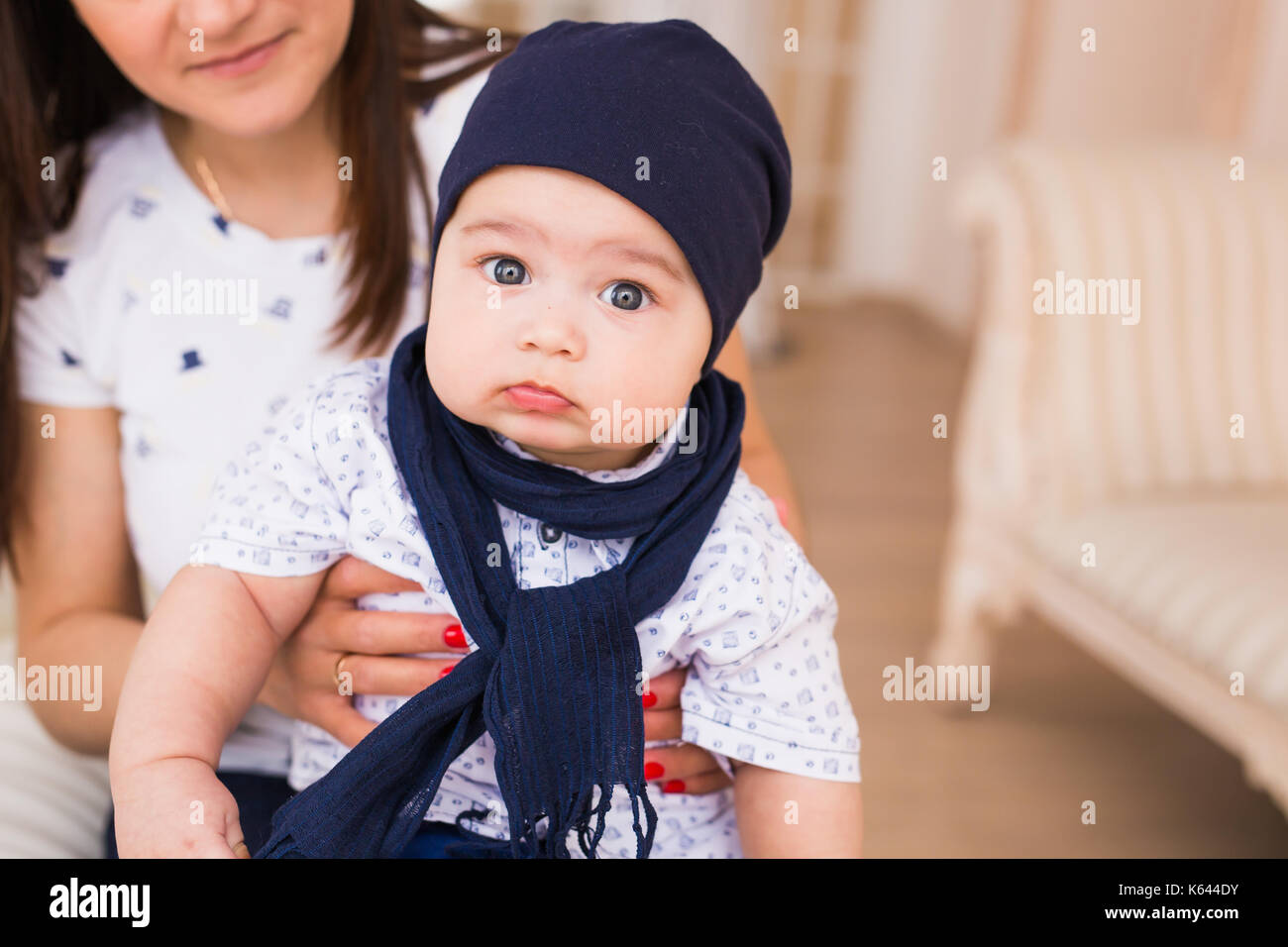 Portrait of cute baby boy wearing blue hat Stock Photo - Alamy