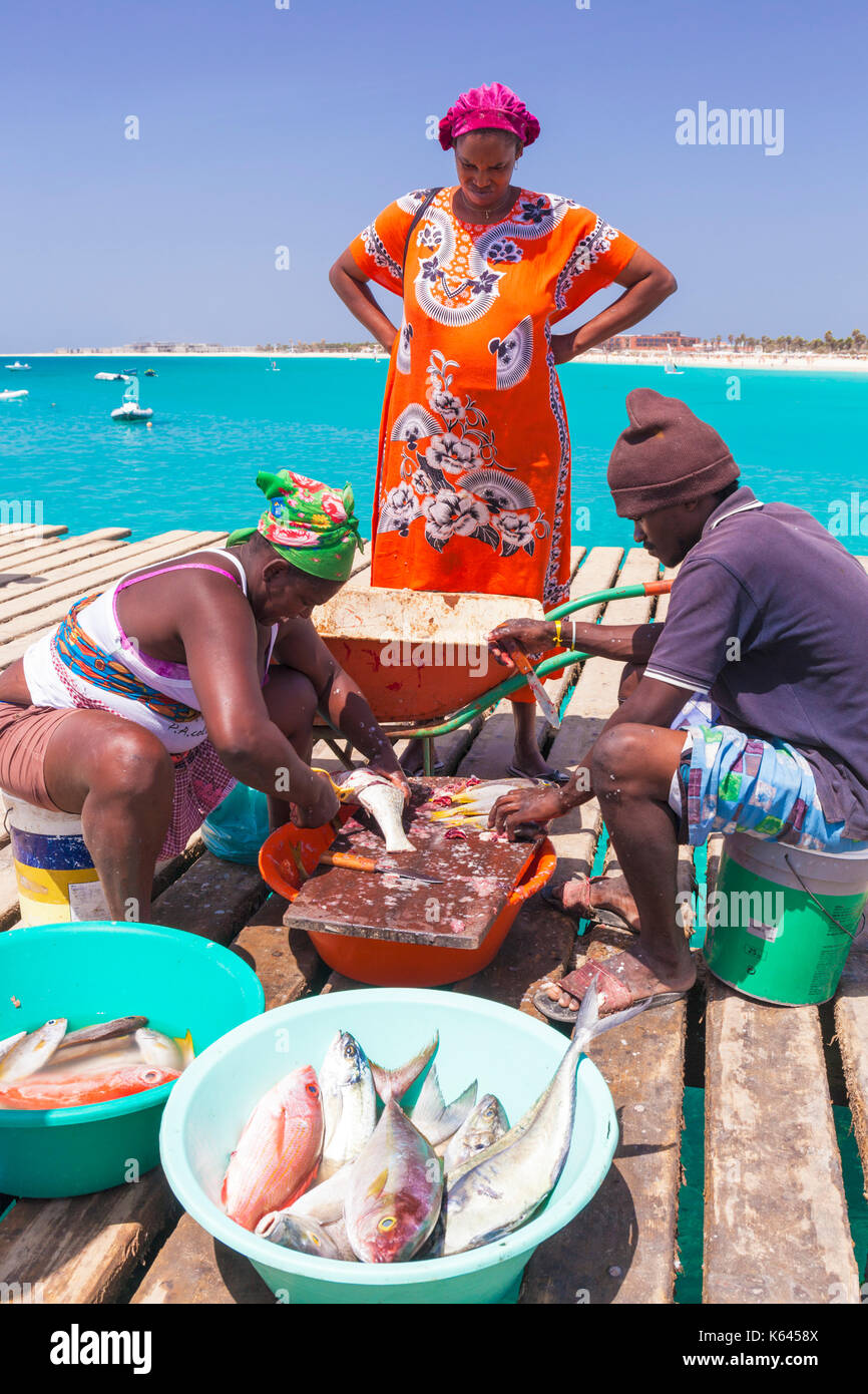 CAPE VERDE SAL Local people scaling and gutting freshly caught fish ...