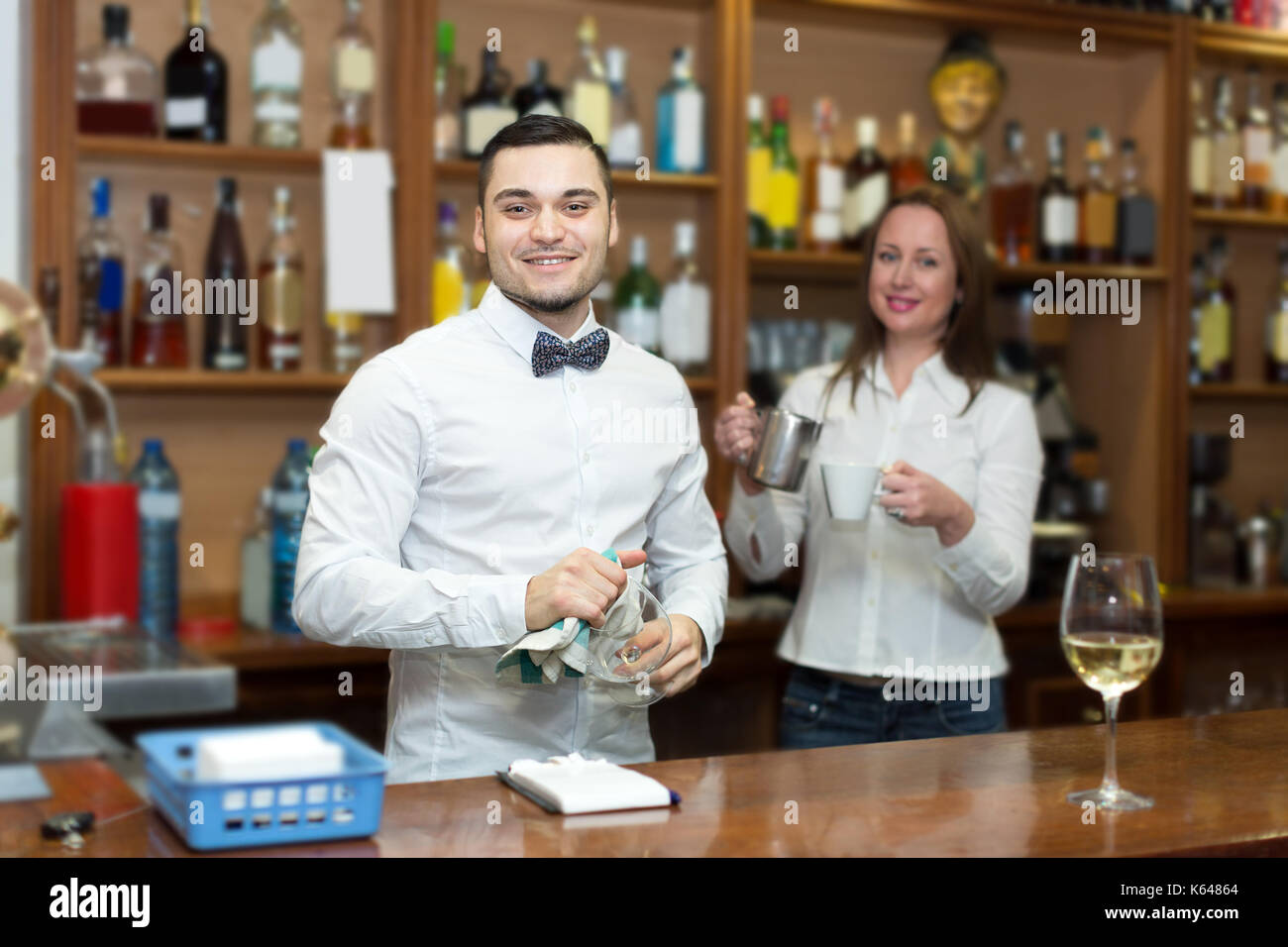 Bar staff working at the customer service counter Stock Photo - Alamy
