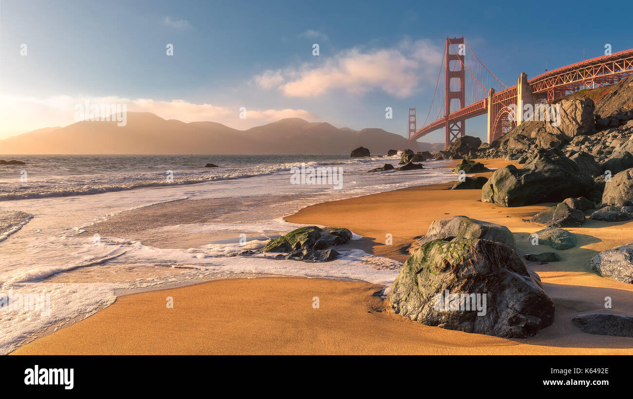 Golden Gate Bridge from the beach in San Francisco at sunset. Stock Photo